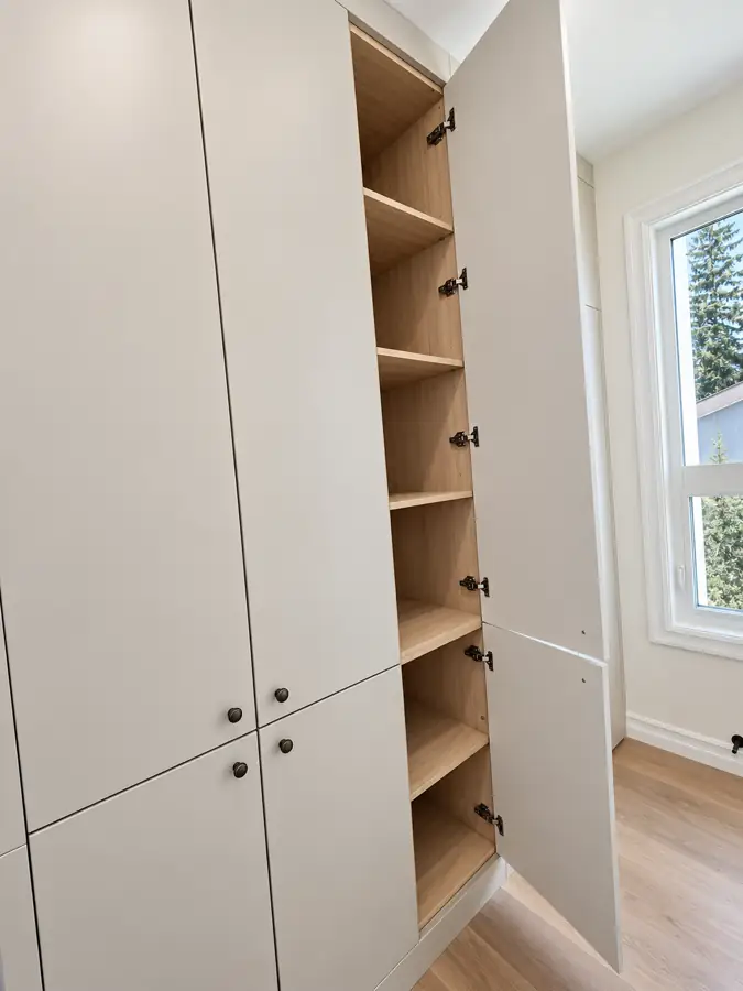 Kitchen: Tall storage run, doors closed