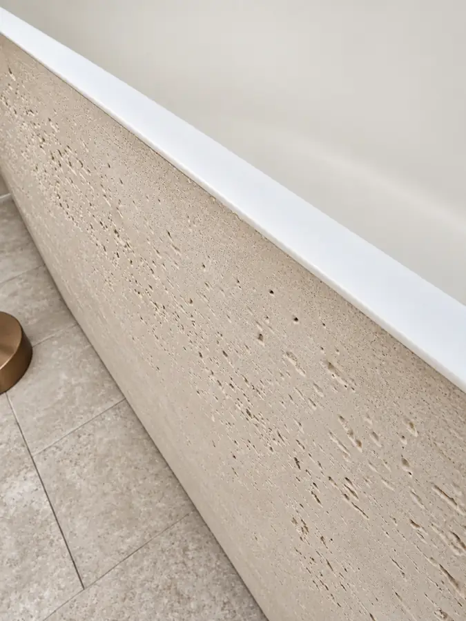 Bathrooms: The stone tub rim, close