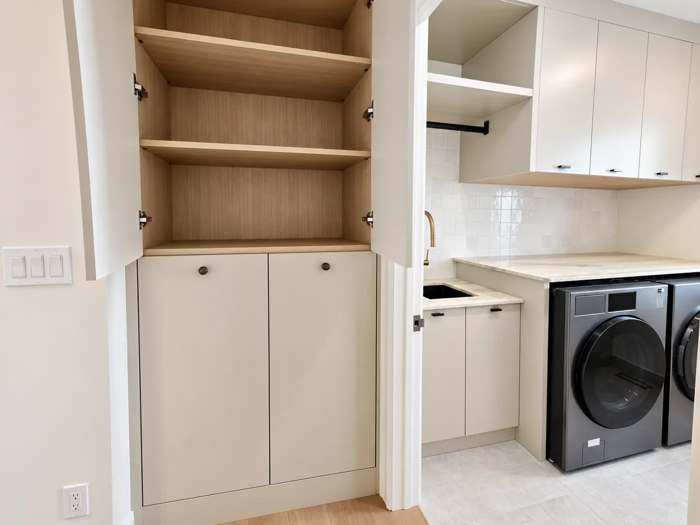 Laundry: the tall utility run open, the machines beyond