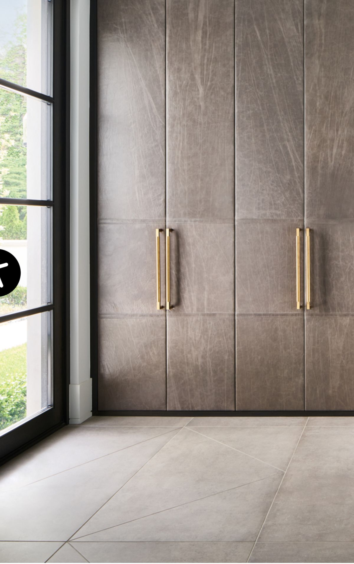 Cabinet door with full-height brass pole handles