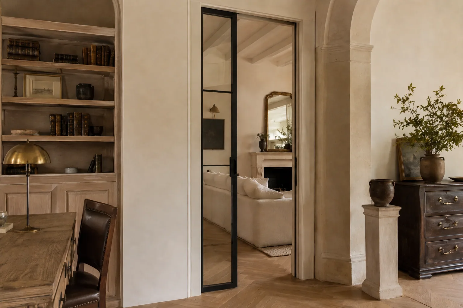 Folding interior glass doors stacked back, opening two rooms into one